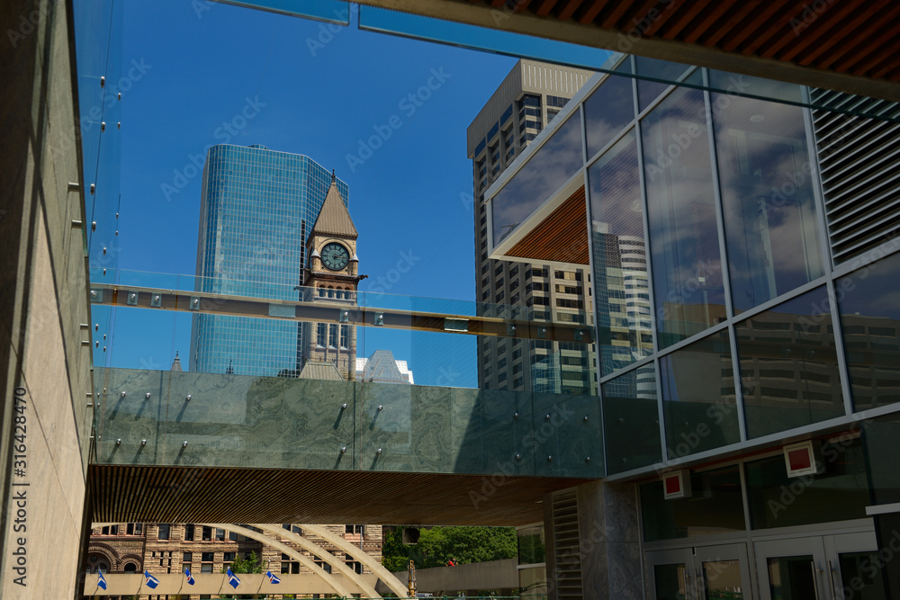 View of old Toronto City Hall through the new skate pavilion and concession building View of old Toronto City Hall through the new skate pavilion and concession building