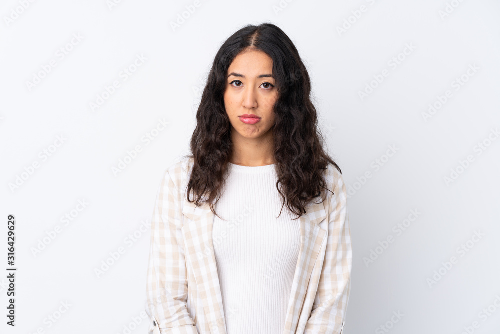 Mixed race woman over isolated white background with sad and depressed expression Mixed race woman over isolated white background with sad and depressed expression