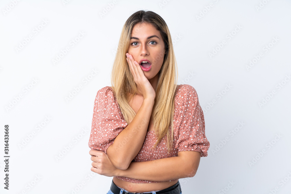 Fototapeta premium Young Uruguayan woman over isolated white background surprised and shocked while looking right