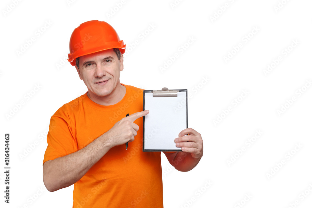 Portrait smiling middle-aged handsome worker wearing orange hard hat, looking to the camera and holding clipboard Portrait smiling middle-aged handsome worker wearing orange hard hat, looking to the camera and holding clipboard