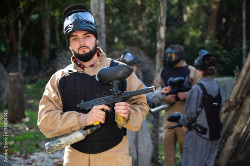 Male paintball player ready for game