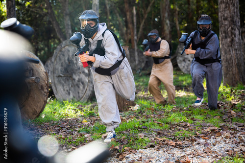 People playing paintball outdoors