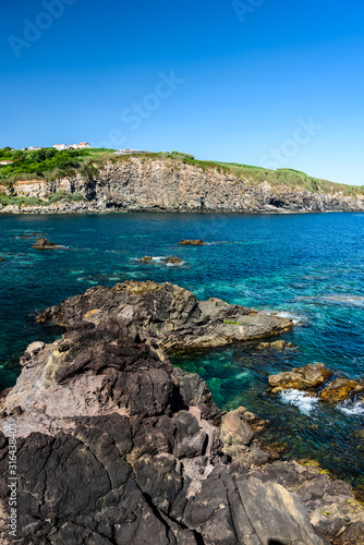 seascape in terceria  view of the rocky seaside in terceira with cliff in the background. seascape in azores  portugal.