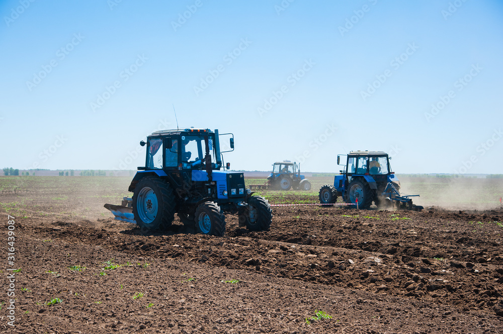 Fototapeta premium Agriculture with a tractor