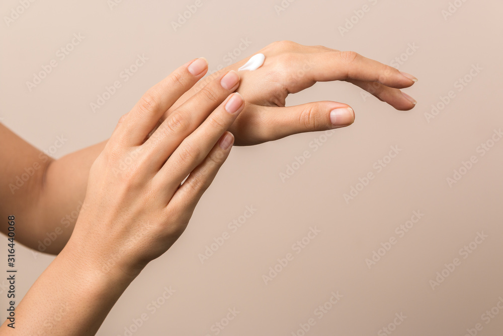 healthy hands of a young woman applying the cream. skincare concept beauty photoshoot - obrazy, fototapety, plakaty 