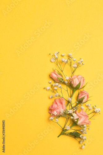 Flowers composition, pink roses on pastel yellow background. Valentines Day, Women's, Mother's day, top view, copy space © Тетяна Шустик