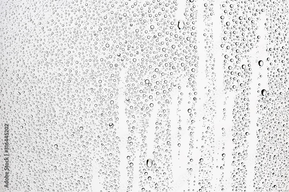 white isolated background water drops on the glass / wet window glass with splashes and drops of water and lime, texture autumn background white isolated background water drops on the glass / wet window glass with splashes and drops of water and lime, texture autumn background