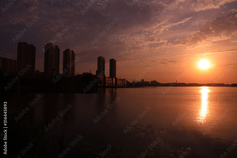 Waterfront city scenery in the evening, China