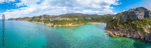 Aerial drone panorama of uninhabited pristine tropical island with limestone rock formation (nosy hara/ madagascar) © Miguel