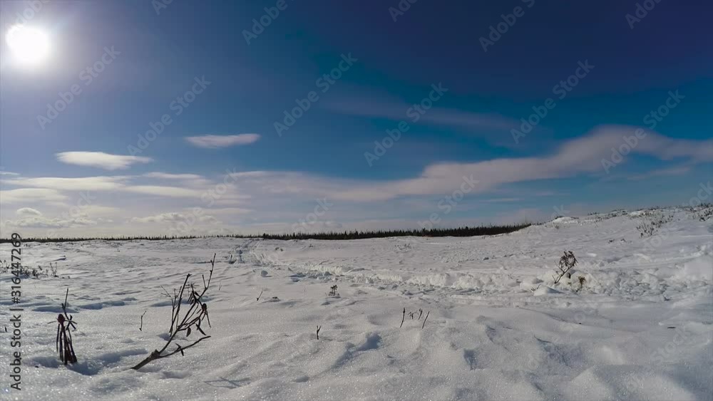 moving clouds on a background of blue sky and bright sun moving clouds on a background of blue sky and bright sun