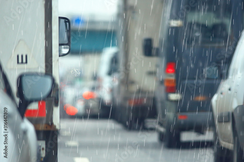 rain road traffic jam / abstract background raindrops in the city on the highway, cars stress autumn © kichigin19