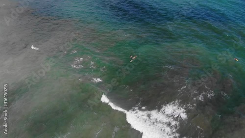 Wallpaper Mural Aerial shot of the sea at Samara, top shot, showing surfing tourists. Shot at sunny weather. Samara, Costa Rica. Torontodigital.ca