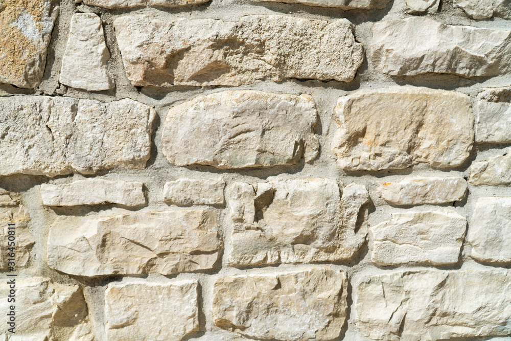 Close Up of Natural Coloured Stone Wall as Background