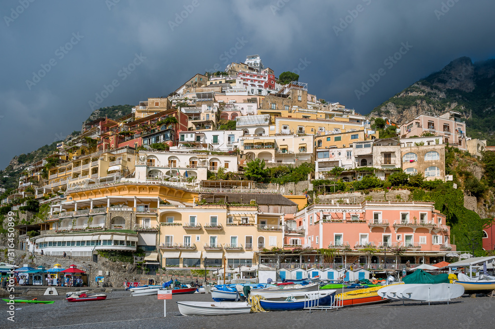 Small boats at Positano beach. Popular travel destination of Amalfi coast, Italy.