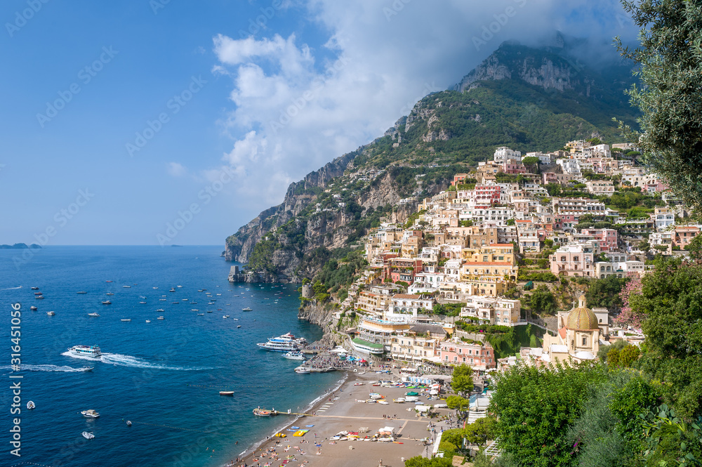 Positano view from hogh viewpoint. Old town and black sand beach. Amalfi coast, Italy.