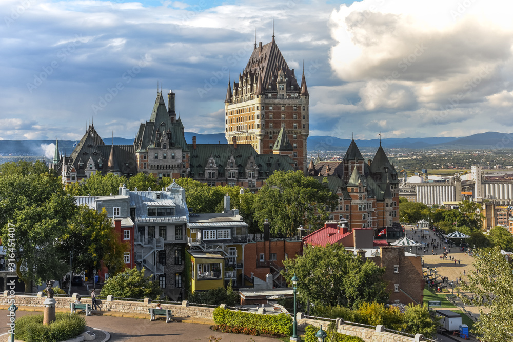 Cityscape of Quebec on a cloudy sunny day, with rainbow in the background. Concept of travel and city. Canada.