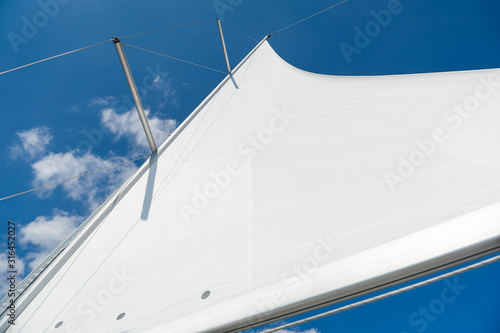 Mast and sail of brand new sailing yacht. Medeiterranean sea, Italy. © AlexanderNikiforov