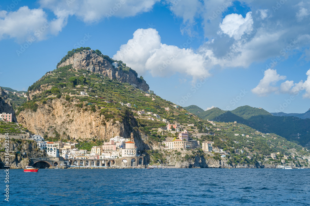 Sailing near Amalfi. Landscape view from the cruising boat to the shore. Amalfi coast, Italy.