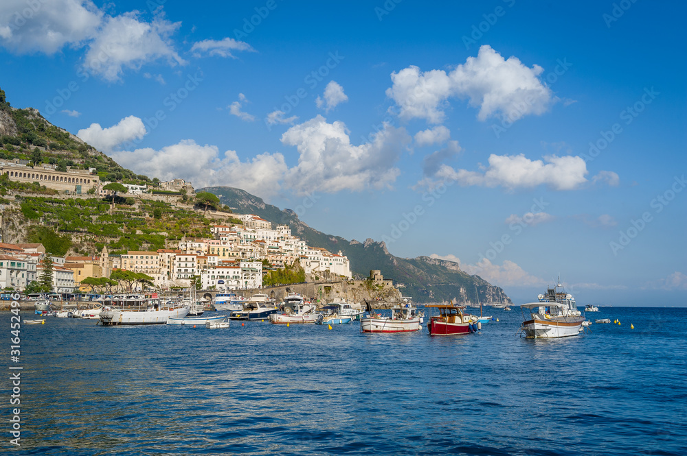 Traditional local fisherman's boats at anchor in Amalfi, Italy.