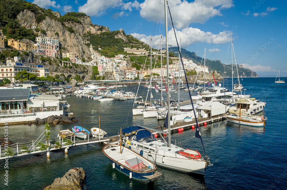 Amalfi old town and harbor panorama. Popular travel attraction of Italy coast.