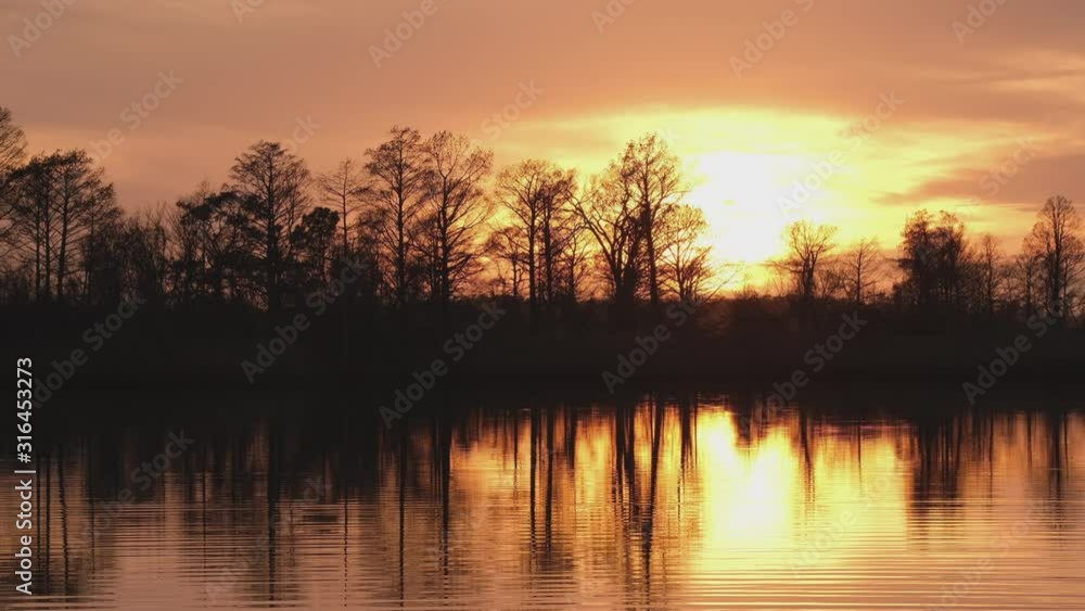 Sunset over Lake Mattamuskeet, a pocosin lake and wildlife refuge in Eastern North Carolina home to many overwintering species of waterfowl.