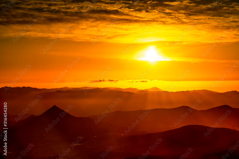 Orange Sunset Glow over Mountains