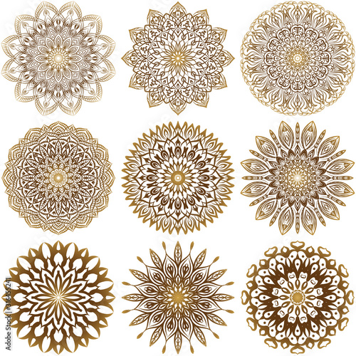 A collection of nine gold mandalas on a white background. Luxurious vector ornament.  