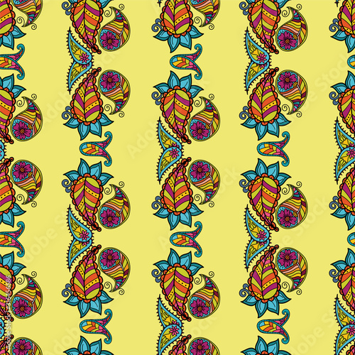 Seamless pattern on the theme of kalamkari. Paisley on a yellow background. Elements of Indian painting Can be used for textiles, patterns, souvenirs and gifts. Bright colours, striped ornament.
