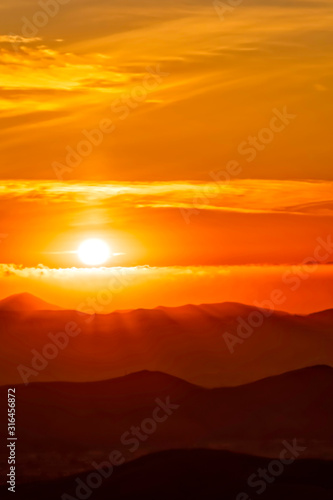 Orange Sunset Glow in Mountains
