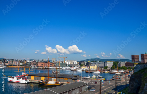 View on harbor at the Aker Brygge and Radhuset (town hall), Oslo, Norway