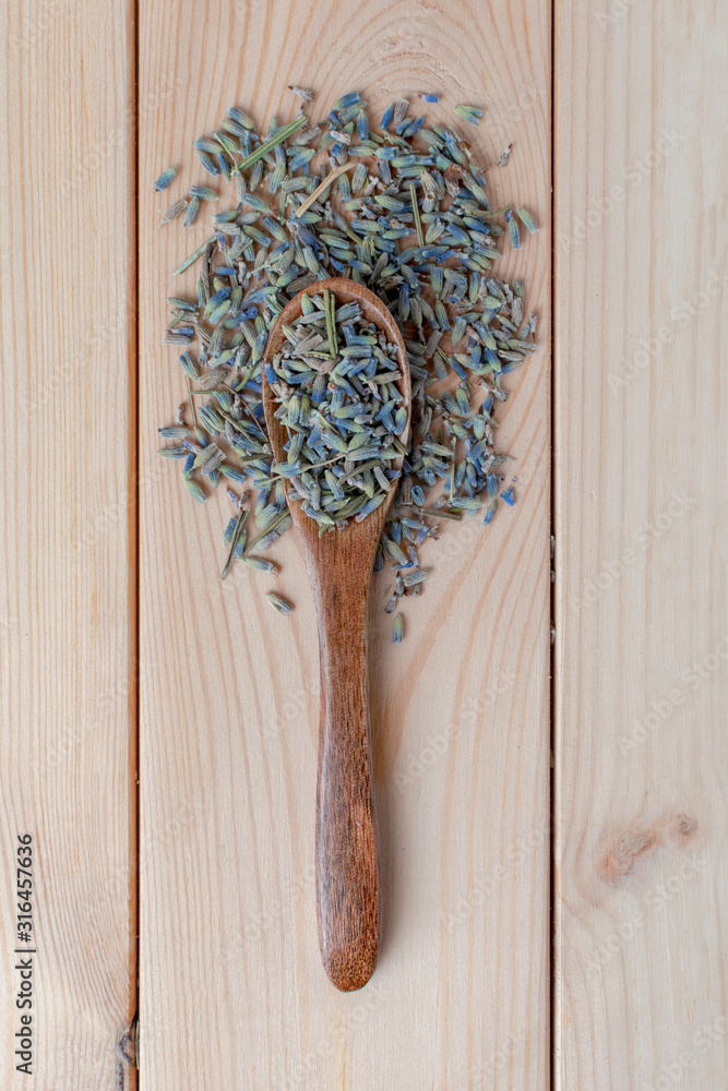 wooned spoon with green tea milk ulun. wood background