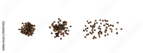 Dry Raw Unpeeled Buckwheat Grains Isolated on White Background photo