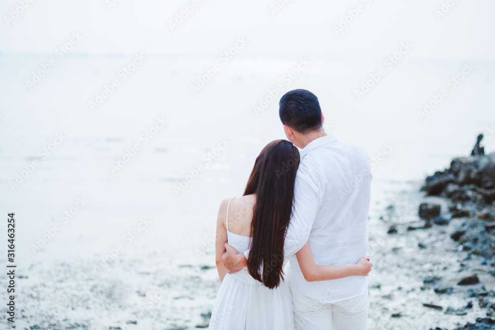 Happy Couple having sweet and romantic on the beach.