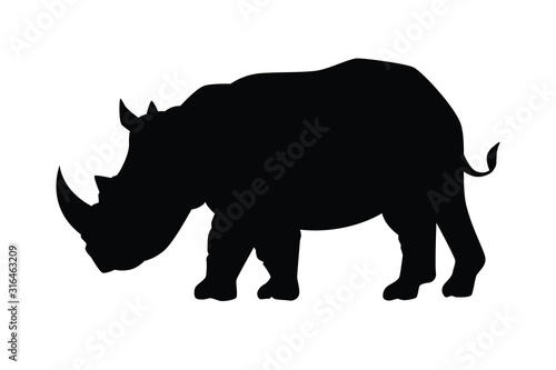 Obraz na plátně Rhinoceros ancient  animal silhouette vector