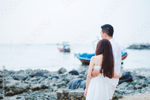 Happy Couple having sweet and romantic on the beach.