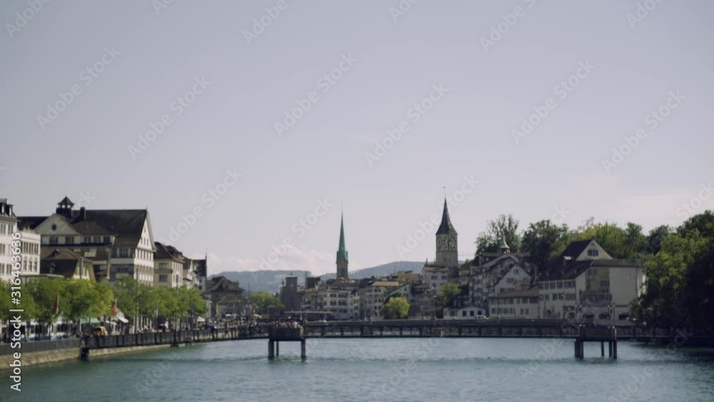 Historic city center of Zurich with famous Fraumunster Church on river Limmat on a sunny day with blue sky, Canton of Zurich, Switzerland Historic city center of Zurich with famous Fraumunster Church on river Limmat on a sunny day with blue sky, Canton of Zurich, Switzerland
