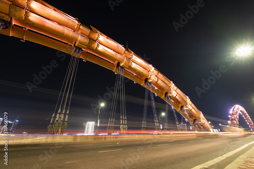 DANANG, VIETNAM - APRIL 19, 2019 - Dragon bridge at night, the famous bridge in Da Nang city, Dragon Bridge can be breath fire and water in weekend.