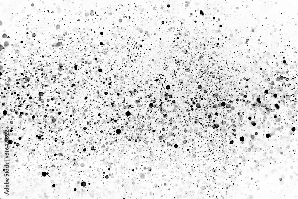 Obraz premium Drops of black bokeh on a white background