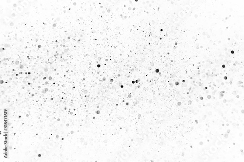 Drops of black bokeh on a white background