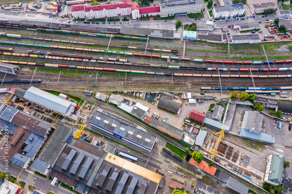 aerial image of railway station depot with freight trains and carriages. drone photography