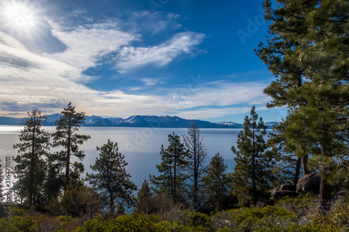 Landscape of trees overlooking Lake Tahoe and distant mountains in Nevada