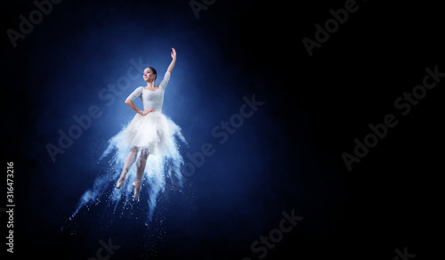 Ballet dancer in jump . Mix...