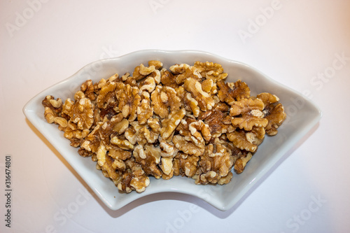 Raw brown Walnuts in a snack bowl