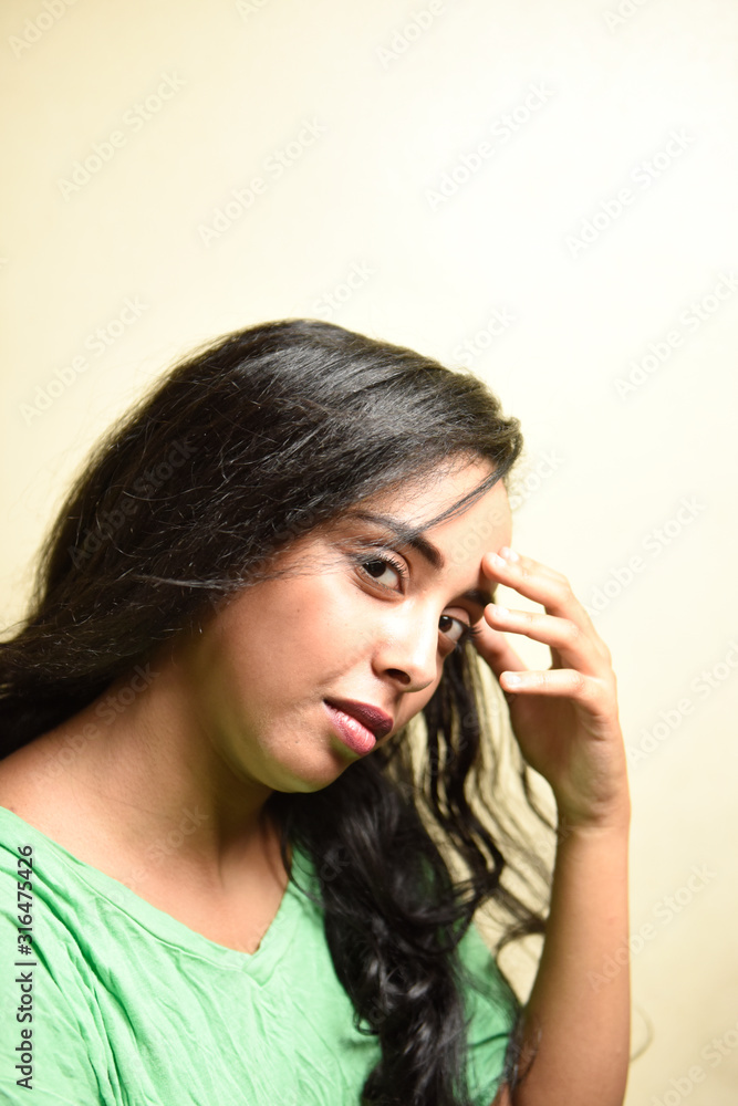 Young african woman wearing shirt over on colorful wood background thinking looking tired and bored with depression problems Young african woman wearing shirt over on colorful wood background thinking looking tired and bored with depression problems