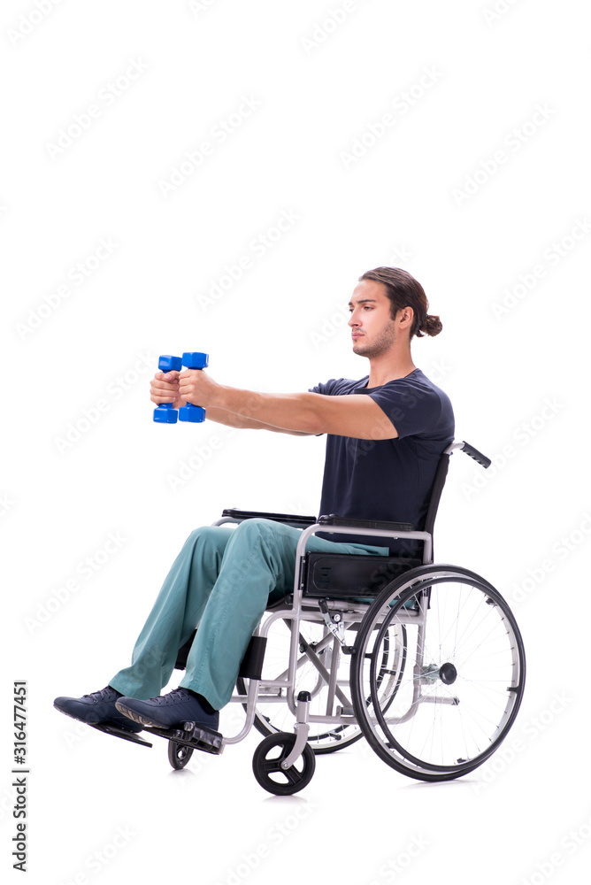 Obraz premium Young disabled man doing physical exercises isolated on white