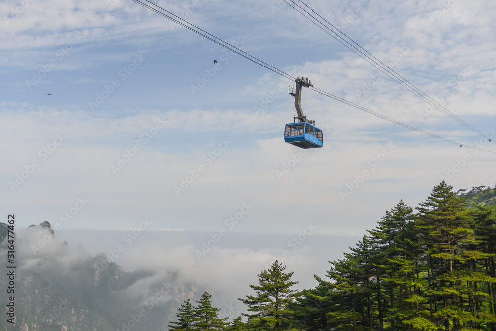 Cable Car on a blue sky with white clouds Background 