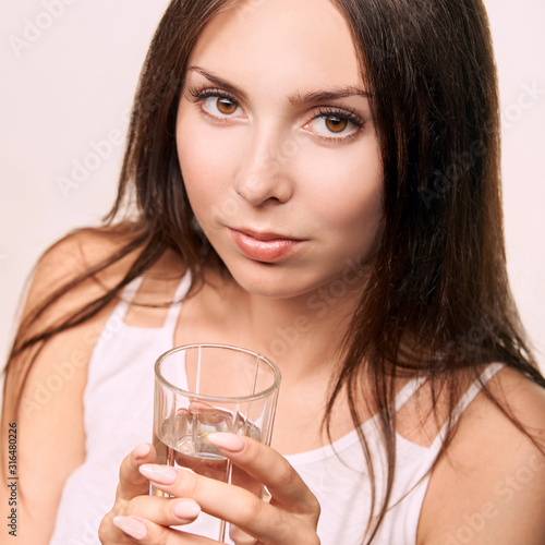 Girl drink pure water at glass. Clean mineral thirsy. Breakfast diet