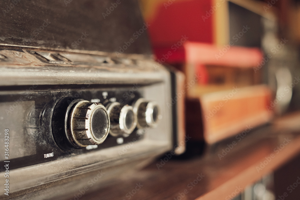 Close-up tunning the button of vintage radio receiver for listen music or  news, Retro style - vintage color tone effect. Stock Photo | Adobe Stock