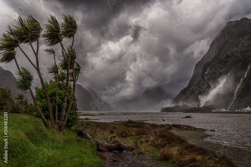 Dramatic wind and clouds during storm at Milford Sound, New Zealand