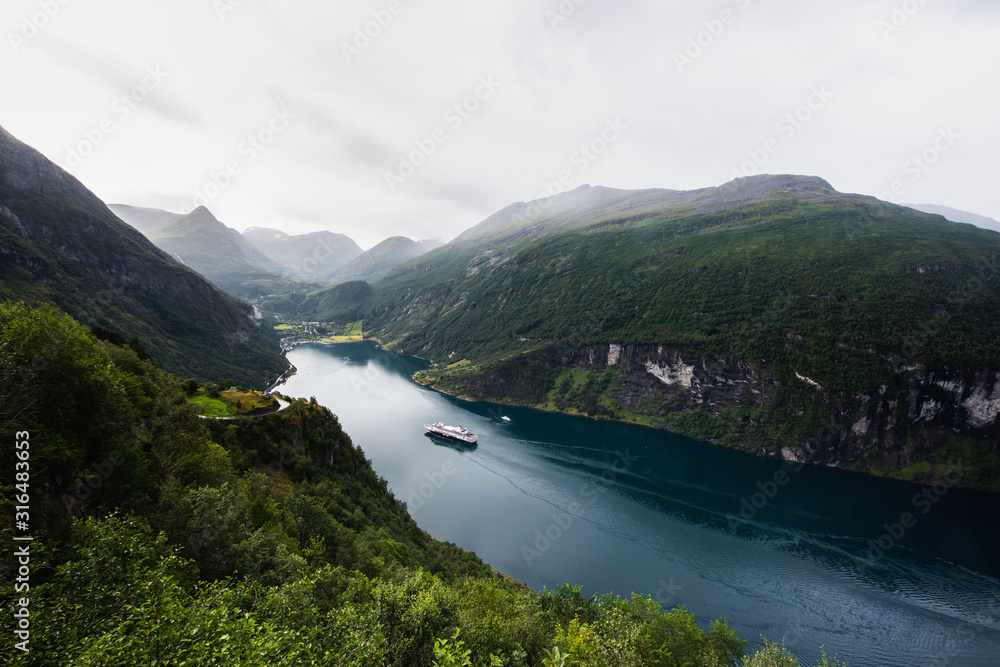 Fjord Geirangerfjord with cruise ship, view from Ornesvingen viewing point, Norway. Travel destination